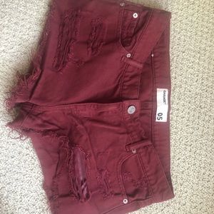 Ripped maroon shorts